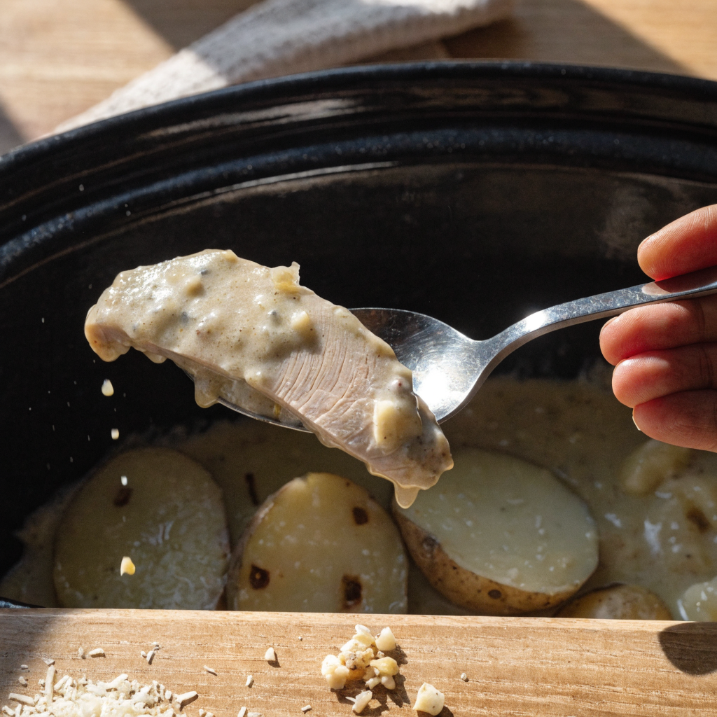 Close-up of garlic parmesan crockpot chicken and potatoes